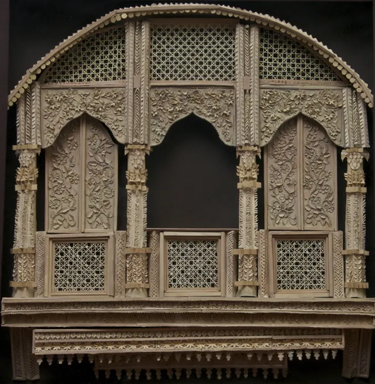 Ivory Jharokha: an arched balcony with lattice windows and carved pillars, all in cream paper